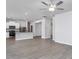 Spacious living room showcasing an open layout and stainless steel kitchen appliances at 11376 International Dr, Middlesex, NC 27557