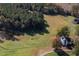 Aerial view of a charming home, pond, barn, and acreage at 206 Pike Memory Ln, Staley, NC 27355