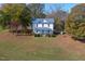 Aerial of two story house on a beautiful lot with mature trees at 206 Pike Memory Ln, Staley, NC 27355
