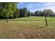 Open field marked by wooden posts, offering ample space and a serene setting at 206 Pike Memory Ln, Staley, NC 27355