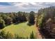 Picturesque land with a mix of open space and wooded areas, perfect for outdoor activities at 206 Pike Memory Ln, Staley, NC 27355