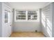 Sun-filled room with tile flooring, multiple windows, offering natural light and pleasant views at 206 Pike Memory Ln, Staley, NC 27355