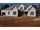 New construction home with architectural shingles and a large front yard at 2408 Toll Mill Ct, Raleigh, NC 27606