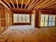 Spacious great room with sliding glass doors and a view of the backyard at 2408 Toll Mill Ct, Raleigh, NC 27606