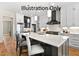 Modern kitchen with large island and white cabinets at 2408 Toll Mill Ct, Raleigh, NC 27606