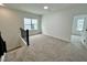 Spacious loft area with carpeting and multiple windows at 109 S Stone Mill W Trl # 238, Clayton, NC 27520