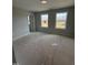 Bright bedroom featuring two windows and new flooring at 3464 Field Poppy Dr # 168, Apex, NC 27502