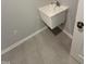 Small utility sink with tiled floors at 2464 Field Poppy Dr # 168, Apex, NC 27502