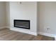Close-up of a modern electric fireplace with a sleek black frame at 409 Marthas View Way, Wake Forest, NC 27587