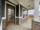 Beautiful front entrance with stone accents and a handsome wooden front door at 409 Marthas View Way, Wake Forest, NC 27587