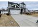 Charming two-story home features an attached two-car garage and concrete driveway at 409 Marthas View Way, Wake Forest, NC 27587