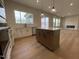 Kitchen with an island that provides a central hub for food preparation and gathering at 409 Marthas View Way, Wake Forest, NC 27587