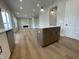 Kitchen island features built-in cabinets and seating, creating a versatile space for cooking and entertaining at 409 Marthas View Way, Wake Forest, NC 27587