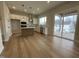 Bright kitchen features white cabinets, stainless steel appliances, and a center island with pendant lighting at 409 Marthas View Way, Wake Forest, NC 27587