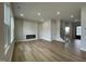 Spacious living room with electric fireplace and hardwood flooring at 409 Marthas View Way, Wake Forest, NC 27587