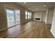 Open-concept living room with a fireplace and access to a screened-in porch via sliding glass doors at 409 Marthas View Way, Wake Forest, NC 27587