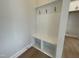 Mudroom with built-in bench and coat hooks for convenient storage and organization at 409 Marthas View Way, Wake Forest, NC 27587