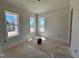 Sun-filled bedroom with multiple large windows providing ample natural light at 6044 Scalybark Road, Durham, NC 27712