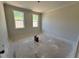 Bedroom with two windows that allow natural light to fill the space at 6044 Scalybark Road, Durham, NC 27712