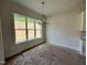 Dining room with large windows with natural light and mountain views at 6044 Scalybark Road, Durham, NC 27712