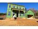 Two-story house under construction with a detached garage at 6044 Scalybark Road, Durham, NC 27712