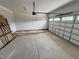 Spacious two-car garage ready for vehicles or storage space with white walls and concrete flooring at 6044 Scalybark Road, Durham, NC 27712