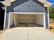 Spacious two-car garage ready for parking and storage, attached to the home at 6044 Scalybark Road, Durham, NC 27712