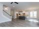 Open kitchen with island, white cabinets, and herringbone tile at 6044 Scalybark Road, Durham, NC 27712