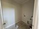 Unfinished laundry room featuring hookups ready for a washer and dryer at 6044 Scalybark Road, Durham, NC 27712