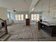 Bright living room featuring large windows, an open layout and abundant natural light at 6044 Scalybark Road, Durham, NC 27712
