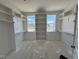 Walk-in closet with built-in shelving units and abundant storage space at 6044 Scalybark Road, Durham, NC 27712