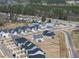 Aerial view of the neighborhood featuring a community pool, and mature trees at 77 Buckhorn Branch Park # 174, Clayton, NC 27520