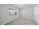 Bright bedroom featuring neutral carpet, window view, and white painted walls at 77 Buckhorn Branch Park # 174, Clayton, NC 27520