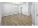 Spacious dining room with hardwood flooring, modern light fixture, and neutral paint at 77 Buckhorn Branch Park # 174, Clayton, NC 27520