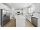 Well-designed kitchen featuring white cabinets, stainless steel appliances, and ample counter space at 77 Buckhorn Branch Park # 174, Clayton, NC 27520