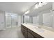Luxury bathroom with double vanity, large mirror, and glass-enclosed shower for a spa-like experience at 77 Buckhorn Branch Park # 174, Clayton, NC 27520