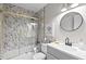 Bathroom with mosaic tile in the shower/tub, gold trim, and updated vanity at 807 W Trinity Ave # 220, Durham, NC 27701