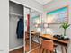 Bedroom closet with sliding mirror doors reflecting the decor and space-saving design at 807 W Trinity Ave # 220, Durham, NC 27701