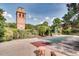Open courtyard features a brick tower, bocce court and greenery filled garden in a well maintained outdoor space at 807 W Trinity Ave # 220, Durham, NC 27701