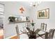 Open dining area with views to a kitchen featuring a serving pass-through at 807 W Trinity Ave # 220, Durham, NC 27701