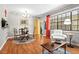 This dining area is brightly lit with a large window and a stylish chandelier at 807 W Trinity Ave # 220, Durham, NC 27701