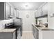 Galley kitchen features granite countertops, stainless steel appliances, and abundant cabinet space at 807 W Trinity Ave # 220, Durham, NC 27701