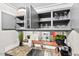 Storage solutions abound in this kitchen with open cabinets and pass through to living area at 807 W Trinity Ave # 220, Durham, NC 27701