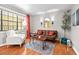 Comfortable living room with a plush armchair, modern rug, and bright window at 807 W Trinity Ave # 220, Durham, NC 27701