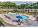 Outdoor swimming pool with lounge chairs and shaded seating areas at 807 W Trinity Ave # 220, Durham, NC 27701