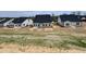 New home backyard featuring a concrete patio, dark roof, and neutral siding at 1060 Fairhaven Dr # 96, Mebane, NC 27302