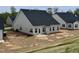 New home backyard featuring a concrete patio, dark roof, and neutral siding at 1060 Fairhaven Dr # 96, Mebane, NC 27302