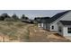 New home backyard featuring a concrete patio, dark roof, and neutral siding at 1060 Fairhaven Dr # 96, Mebane, NC 27302
