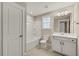 Bright bathroom featuring a shower, white cabinets, and modern fixtures at 1060 Fairhaven Dr # 96, Mebane, NC 27302