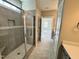 Primary bathroom featuring a glass enclosed shower with tiled surround and a view to the bedroom at 1060 Fairhaven Dr # 96, Mebane, NC 27302